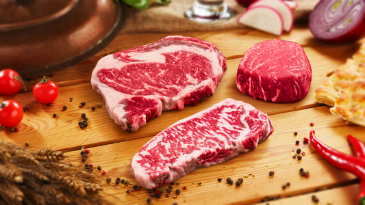 Marbled Meatery USA sampler package with two American Wagyu New York strip steaks on wooden board, showcasing domestic heritage steak excellence.