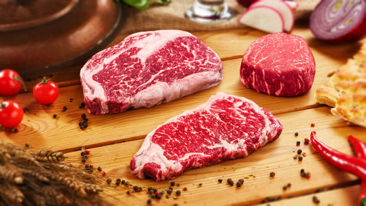 Marbled Meatery Australian Wagyu sampler package featuring filet mignon, ribeye, and New York strip steaks with exceptional marbling from Australian heritage ranches.